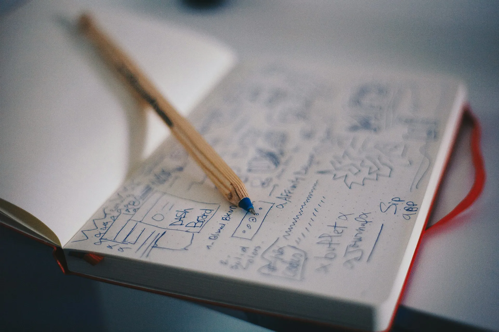 Planning a website design (notebook sketch)